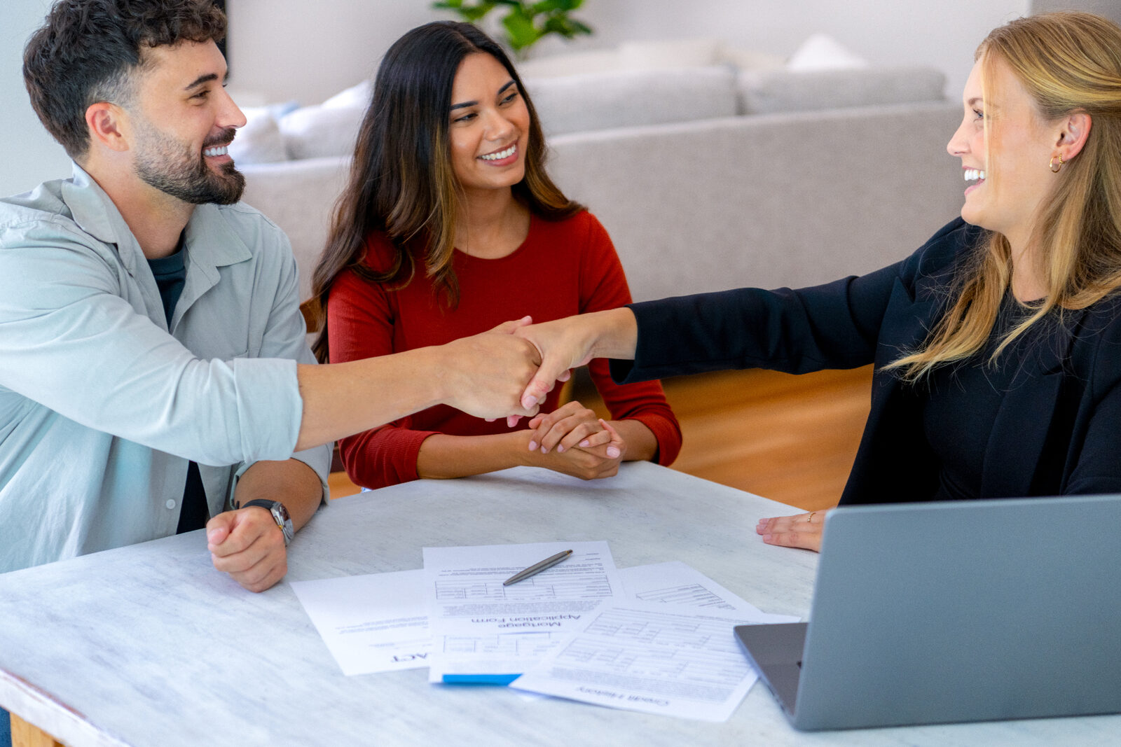Buyer and seller meeting with a conveyancing professional during a Victorian property transaction