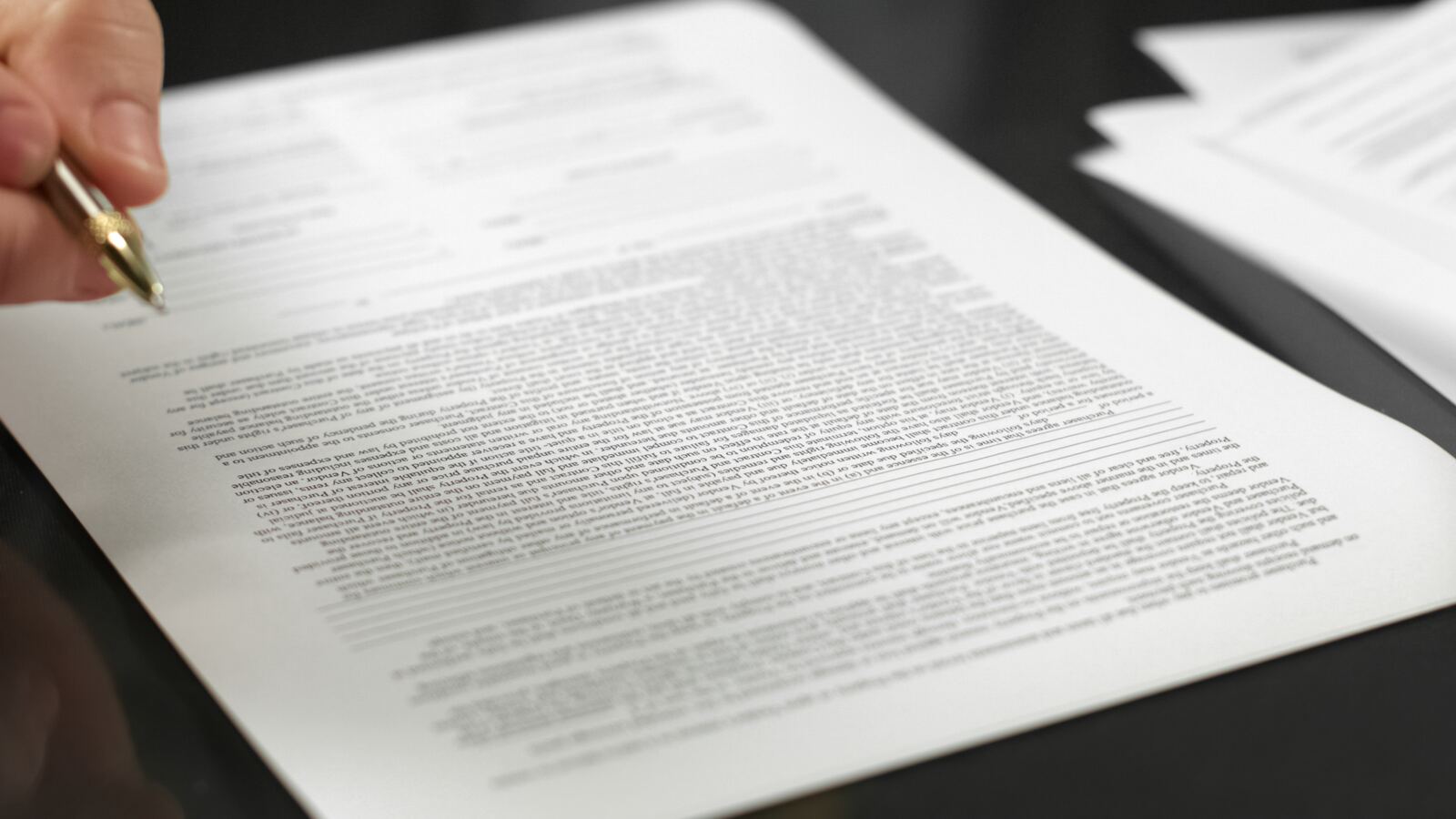 Close review of a printed contract — illustrative of careful legal scrutiny of the Section 32 vendor statement.
